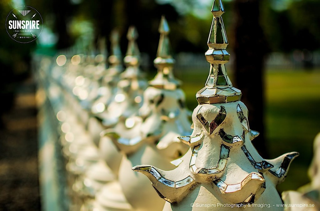 Bokeh photo of a fence surrounding Wat Rong Khun (White Temple), Chiang Rai, Thailand